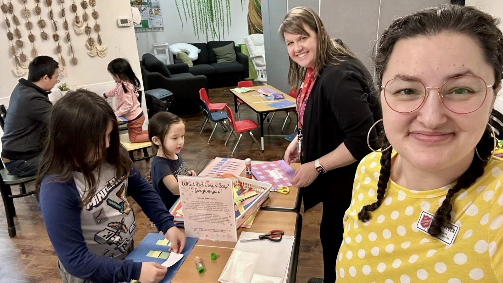 Adults and children doing crafts